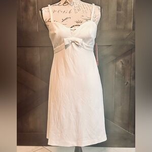 White mini dress sweetheart w triangle peep & bow tie on front low cut back S
